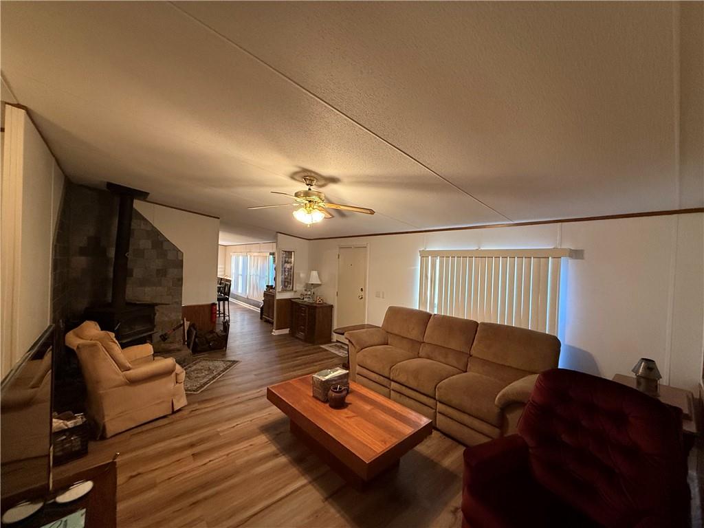 1106 Gary Road Rockwood, PA 15557 - Photo 2 of 46 a living room with furniture a ceiling fan and a rug