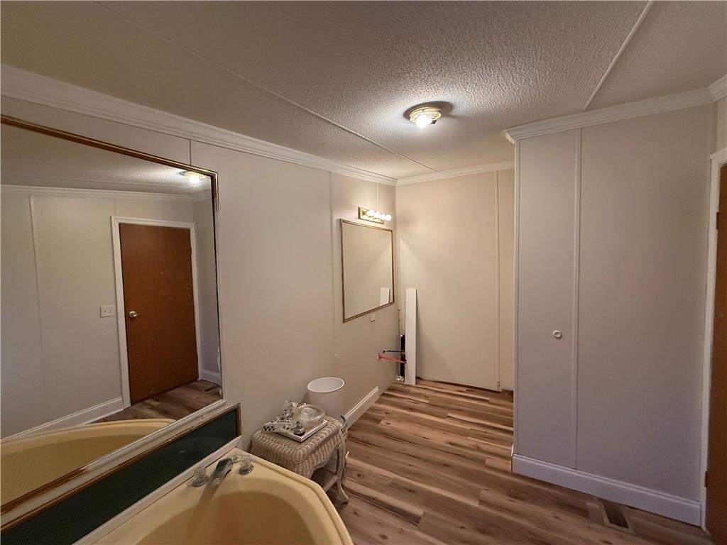 1106 Gary Road Rockwood, PA 15557 - Photo 21 of 46 a bedroom with a bed and a mirror