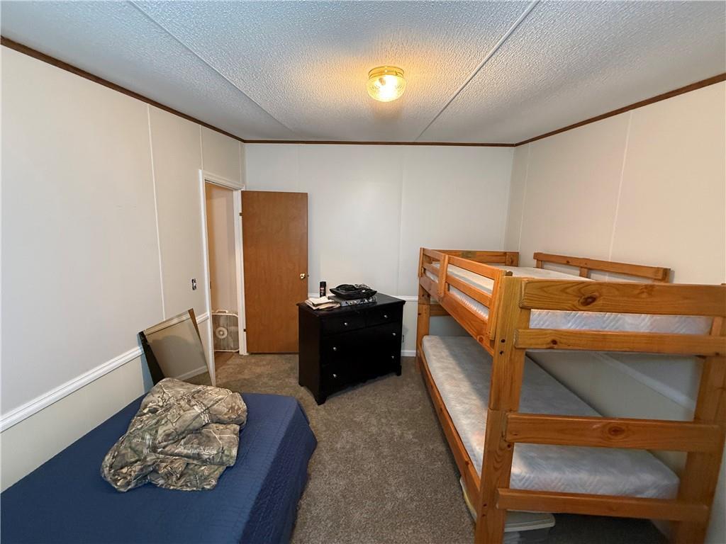 1106 Gary Road Rockwood, PA 15557 - Photo 28 of 46 a bedroom with a bed and a couch