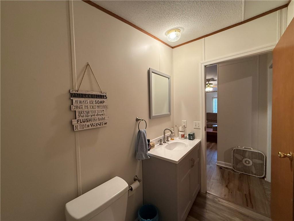1106 Gary Road Rockwood, PA 15557 - Photo 32 of 46 a bathroom with a toilet a sink and mirror