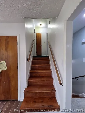 a view of staircase with lots of frames and stairs