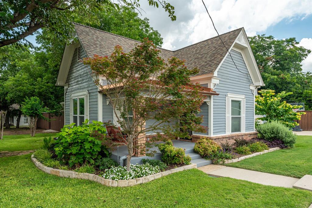 9121 6th Street Frisco, TX 75033 - Photo 1 of 27 a view of house with a yard and potted plants