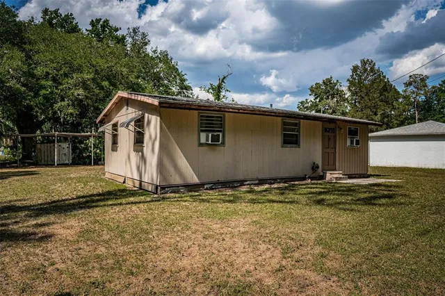 a backyard of a house with lots of green space
