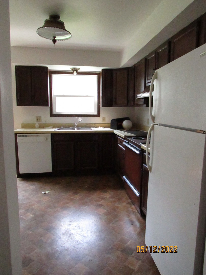 1641 Park Avenue Sycamore, IL 60178 - Photo 5 of 6 a kitchen with a refrigerator and a sink