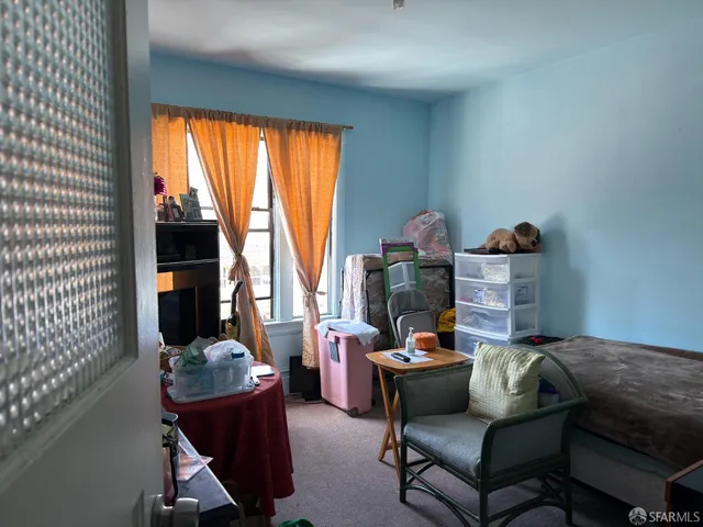 a bathroom with a sink a toilet a tub and shower