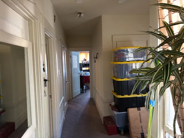 a bedroom with bed window and a couch