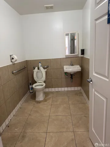 a bathroom with a shower and a sink
