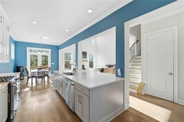 a kitchen with stainless steel appliances a refrigerator and a sink