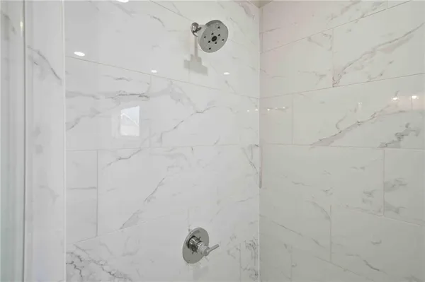 a white bath tub sitting in a bathroom