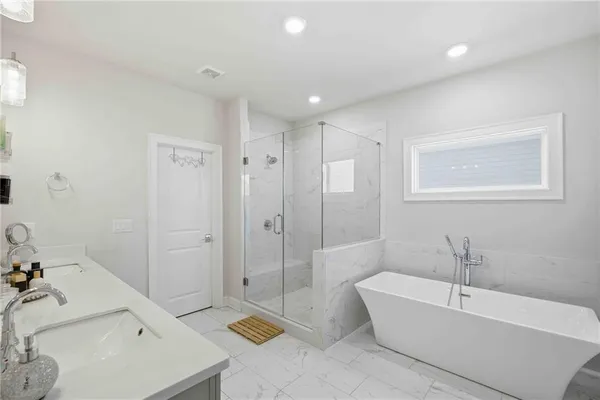 a bathroom with a bathtub and a shower