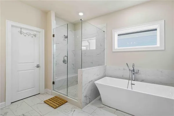 a bathroom with a double vanity sink mirror and