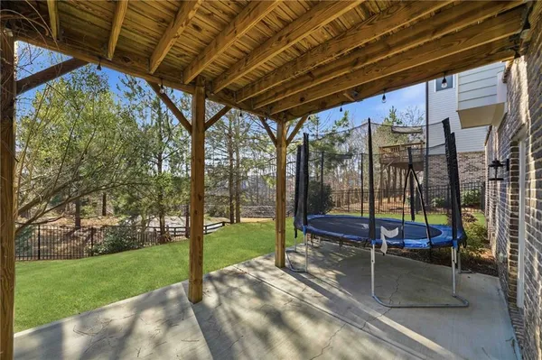 a view of a house with a yard and sitting area