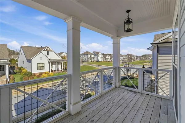 a view of a balcony with furniture
