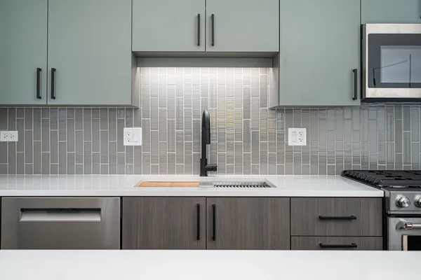 a kitchen with a sink and cabinets