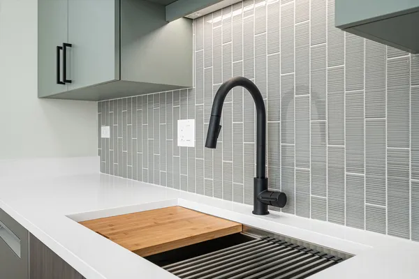 a kitchen with a stove and a sink