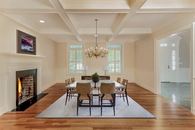 85 Seapuit Road Osterville, MA 02655 - Photo 4 of 22 a dining room with wooden floor a chandelier a wooden table and chairs