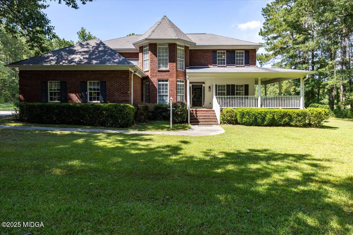 9481 Hopewell Road Musella, GA 31066 - Photo 1 of 72 a front view of a house with a yard