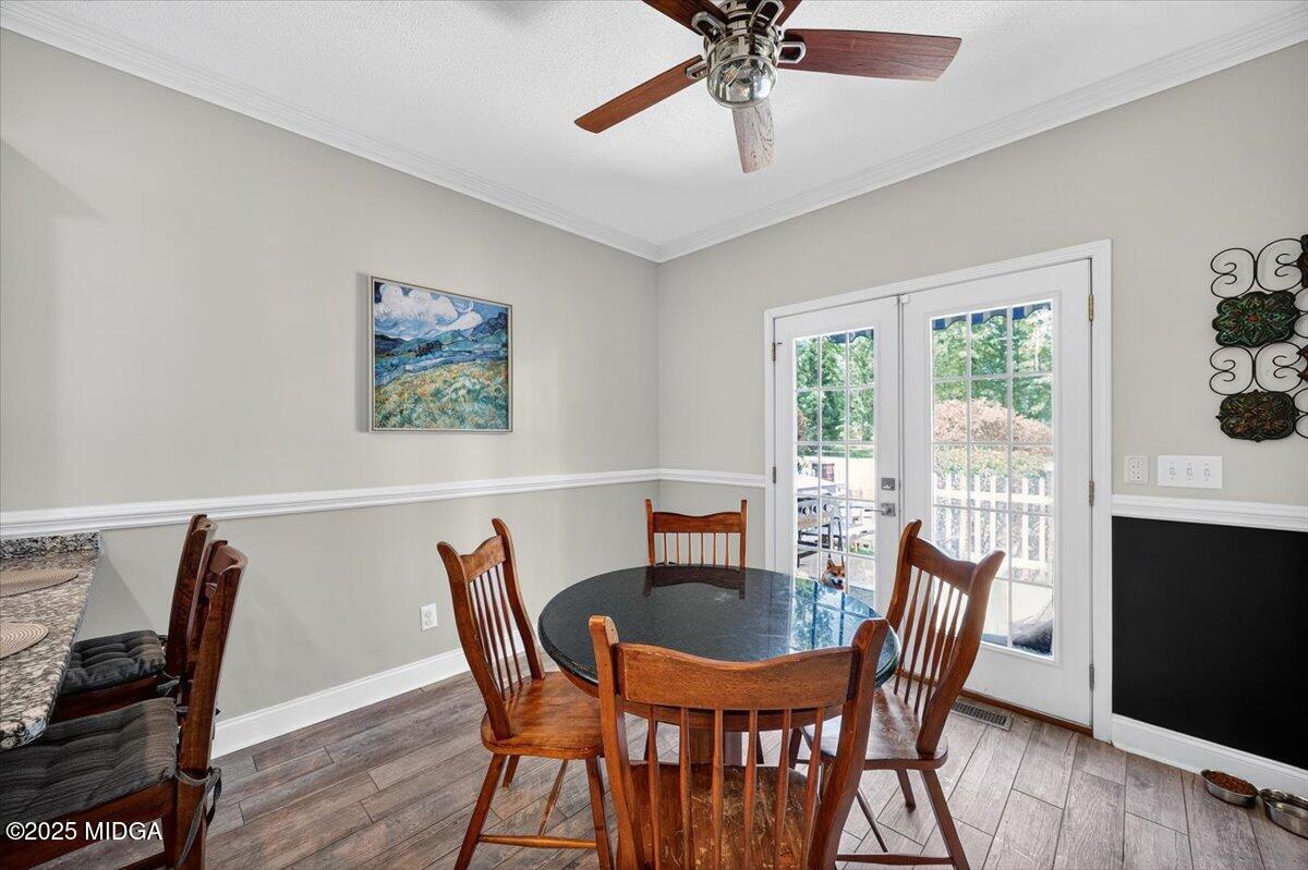 9481 Hopewell Road Musella, GA 31066 - Photo 16 of 72 a view of a dining room with furniture window and wooden floor