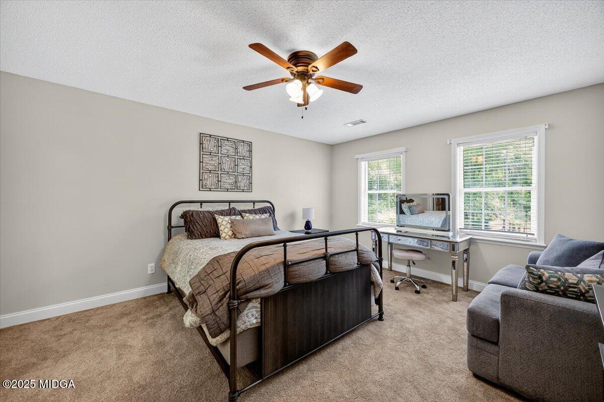 9481 Hopewell Road Musella, GA 31066 - Photo 27 of 72 a bed room with a bed and a couch