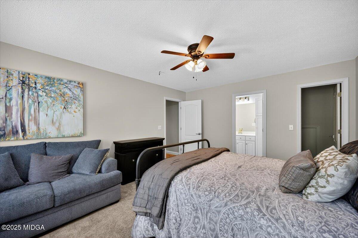 9481 Hopewell Road Musella, GA 31066 - Photo 29 of 72 a bedroom with a bed couch and window