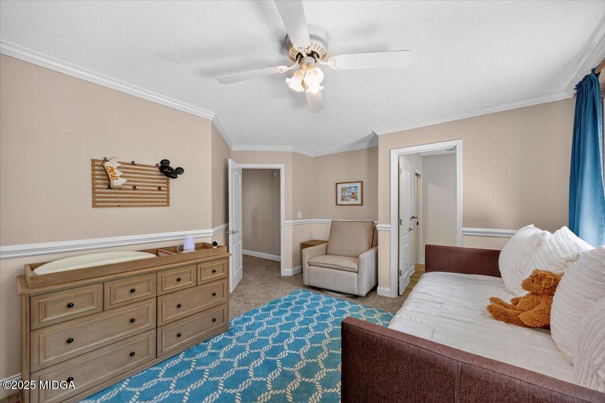 9481 Hopewell Road Musella, GA 31066 - Photo 36 of 72 a bedroom with a bed and ceiling fan