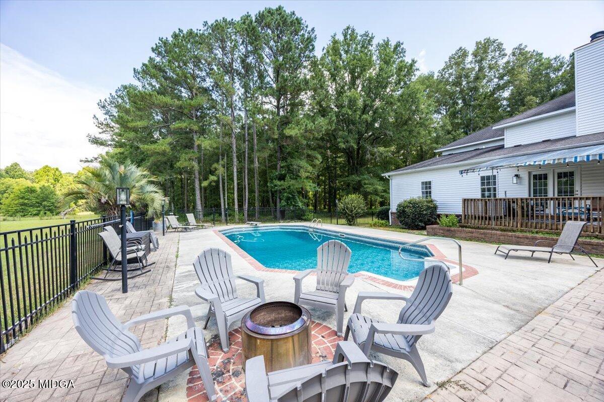 9481 Hopewell Road Musella, GA 31066 - Photo 42 of 72 a view of a house with swimming pool and sitting area