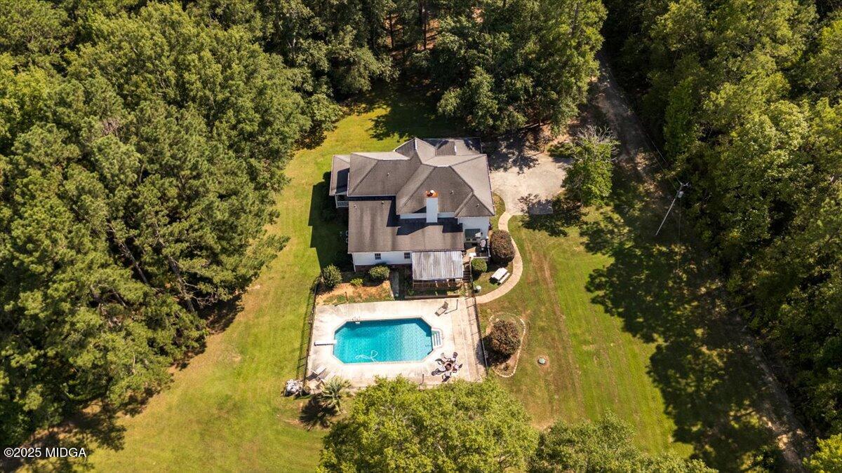 9481 Hopewell Road Musella, GA 31066 - Photo 47 of 72 an aerial view of a house with swimming pool and garden