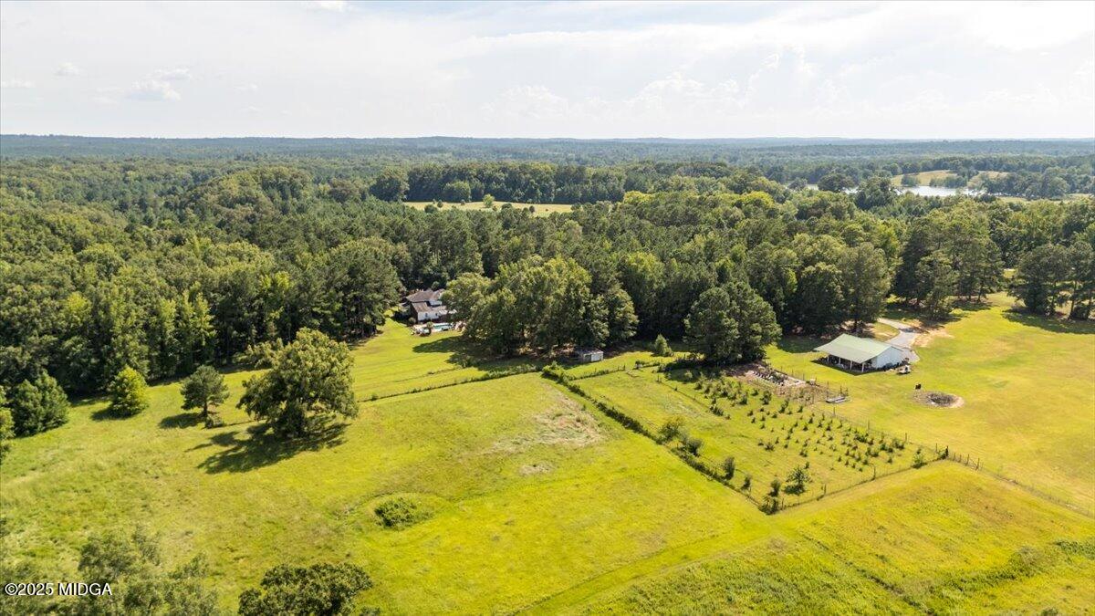 9481 Hopewell Road Musella, GA 31066 - Photo 50 of 72 a view of a swimming pool with a yard