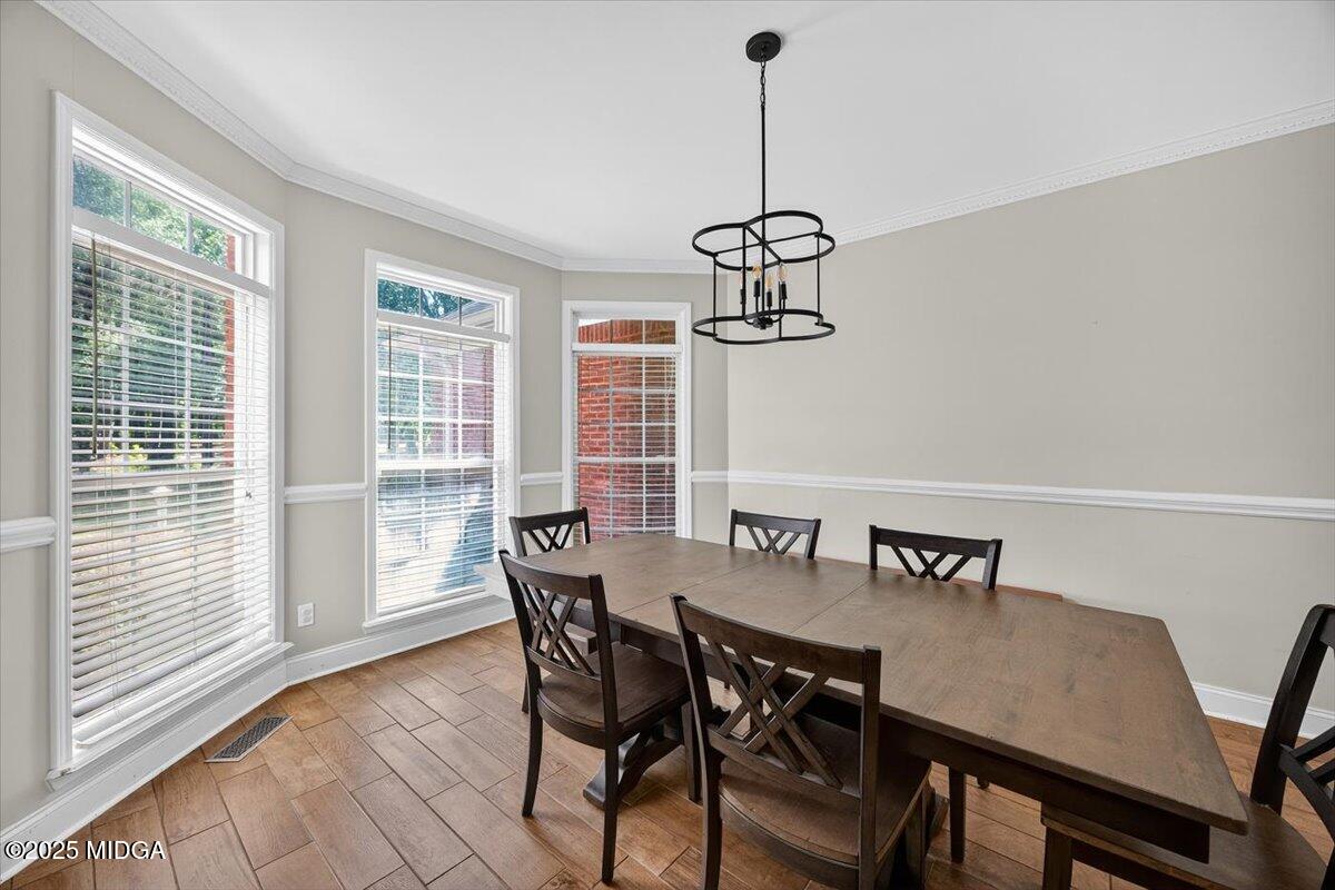 9481 Hopewell Road Musella, GA 31066 - Photo 6 of 72 a view of a dining room with furniture window and wooden floor
