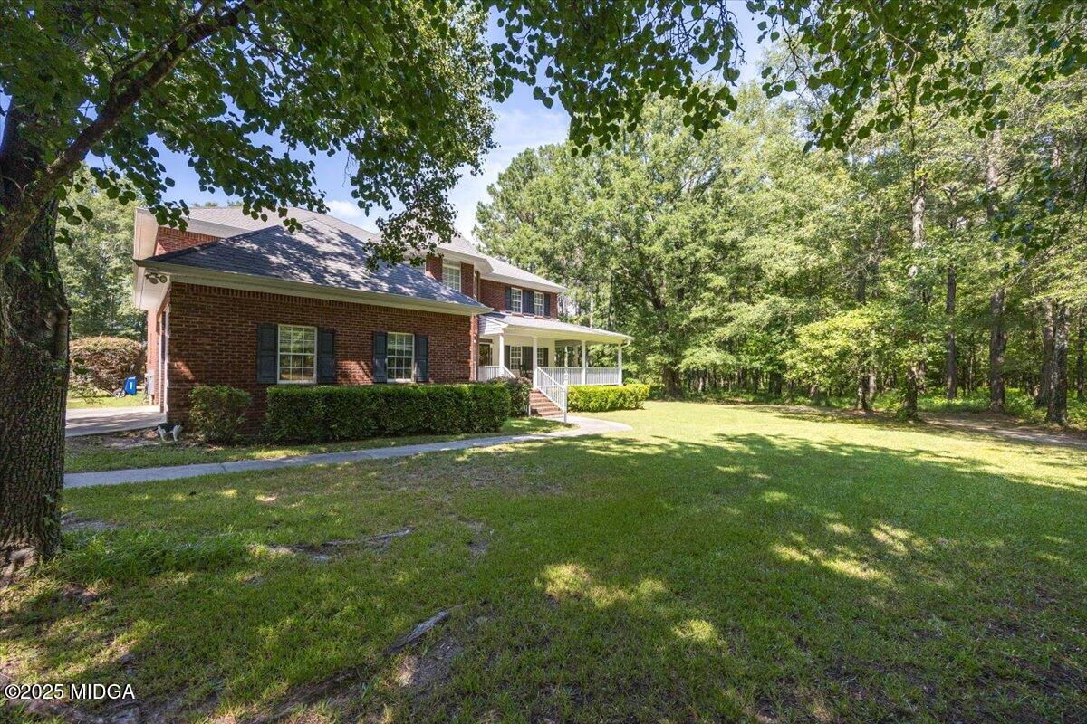 9481 Hopewell Road Musella, GA 31066 - Photo 68 of 72 a front view of a house with a yard