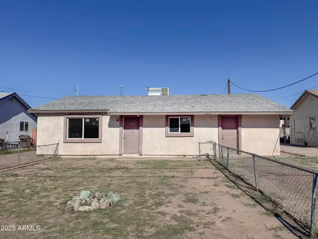 a front view of a house with yard