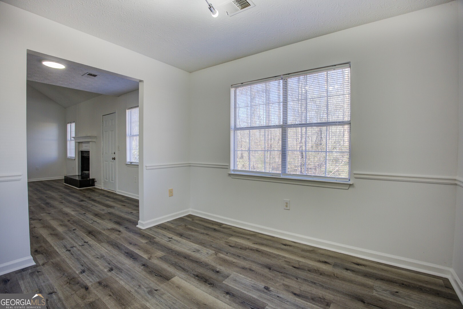 40 Brandon Drive Covington, GA 30016 - Photo 16 of 40 wooden floor in an empty room with a window