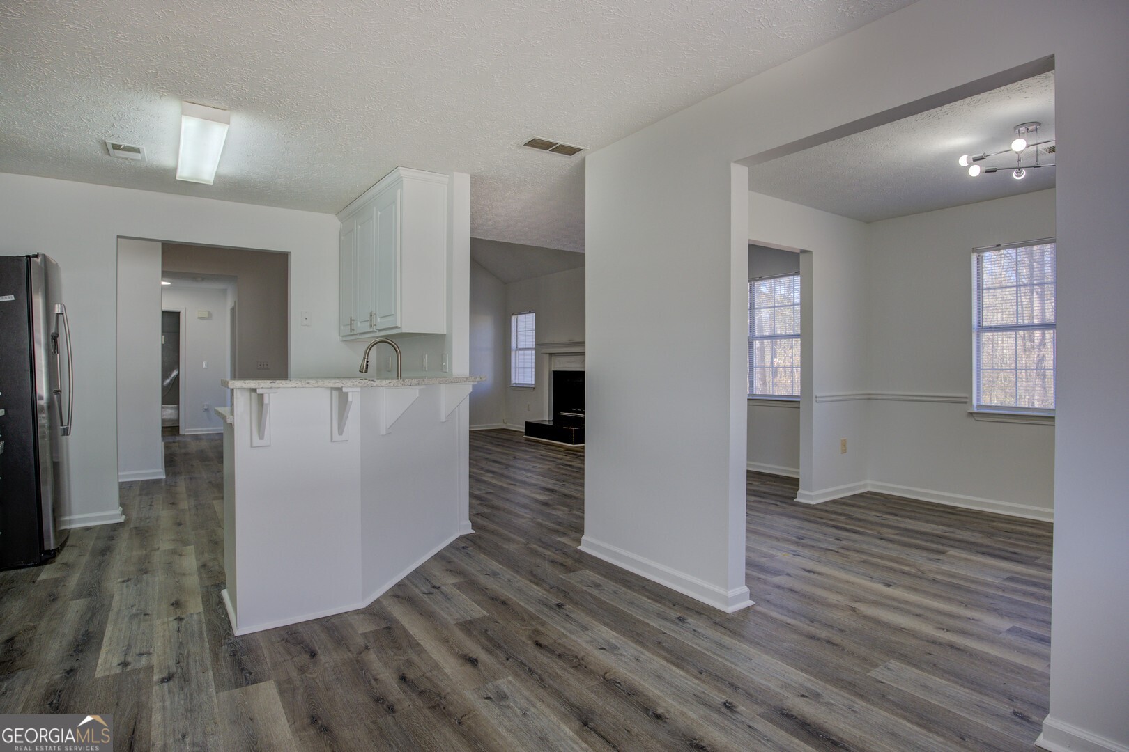 40 Brandon Drive Covington, GA 30016 - Photo 19 of 40 a view of a living room with wooden floor