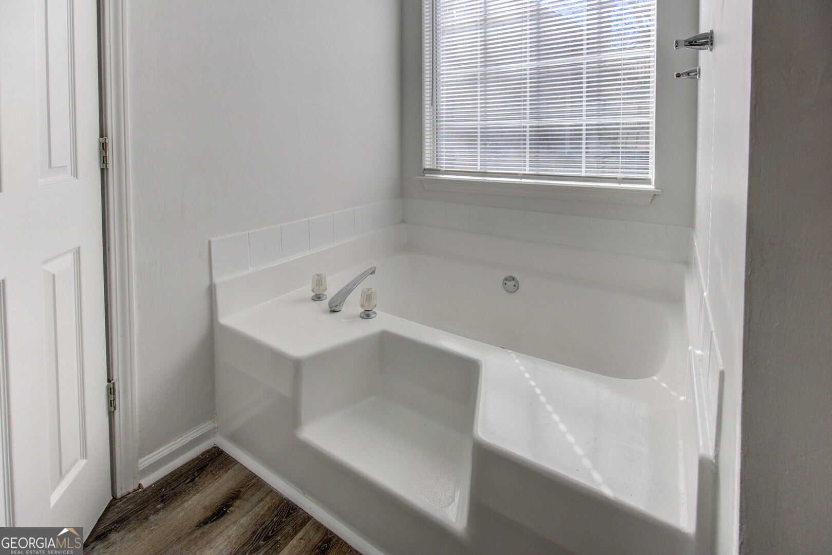 40 Brandon Drive Covington, GA 30016 - Photo 30 of 40 a bathroom with a bathtub