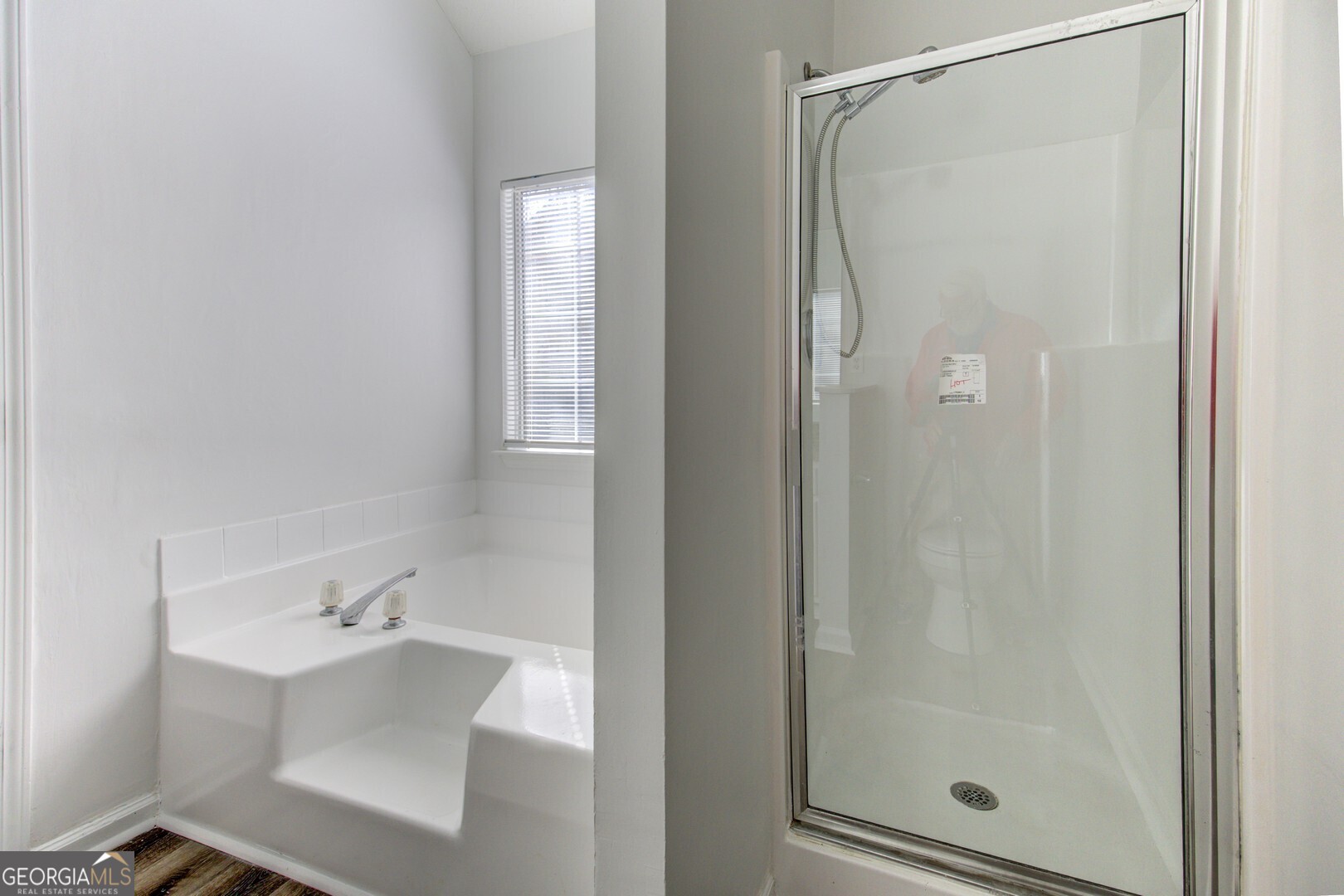 40 Brandon Drive Covington, GA 30016 - Photo 31 of 40 a bathroom with a shower and a sink