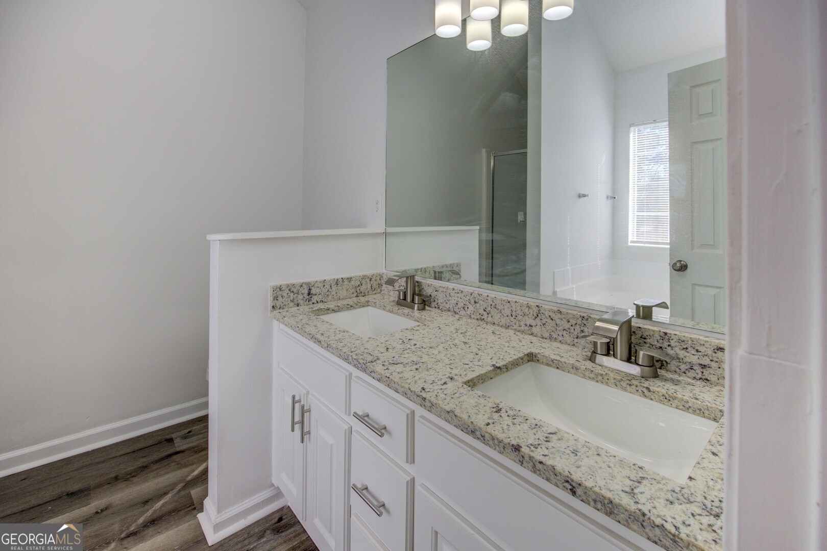 40 Brandon Drive Covington, GA 30016 - Photo 37 of 40 a bathroom with a granite countertop sink and a mirror