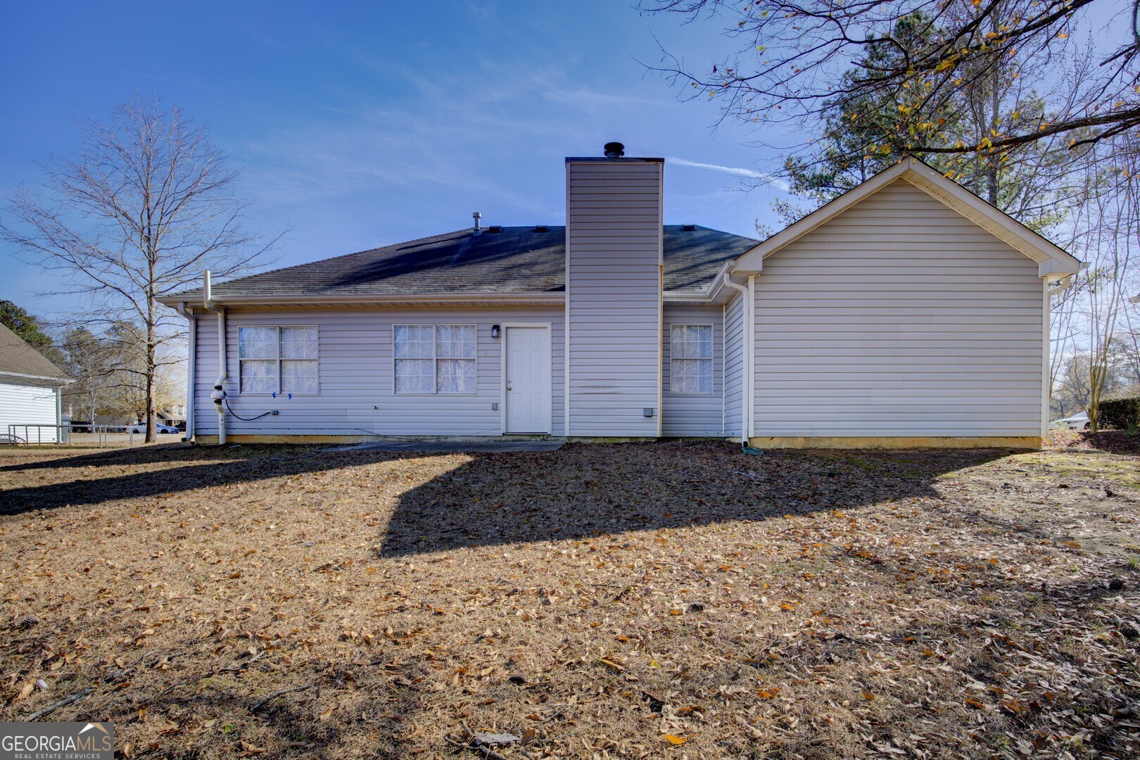 40 Brandon Drive Covington, GA 30016 - Photo 40 of 40 a house view with a backyard space