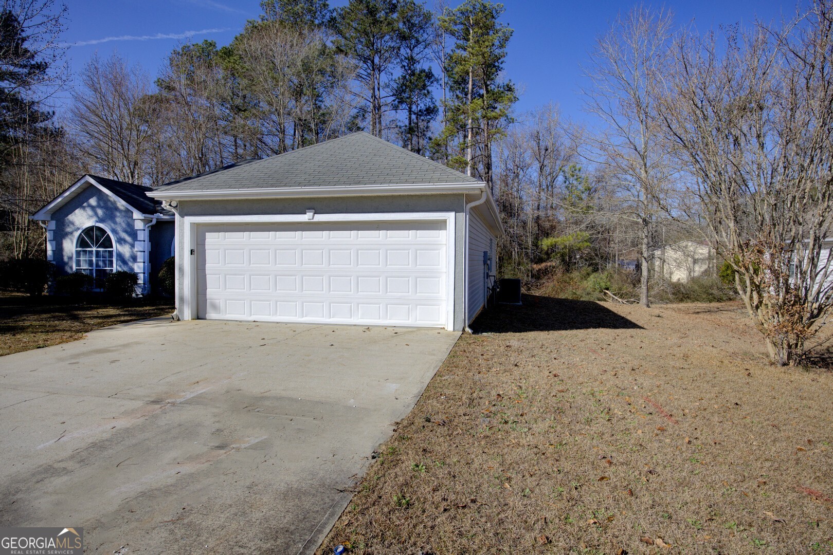 40 Brandon Drive Covington, GA 30016 - Photo 6 of 40 a front view of a house with a yard and garage