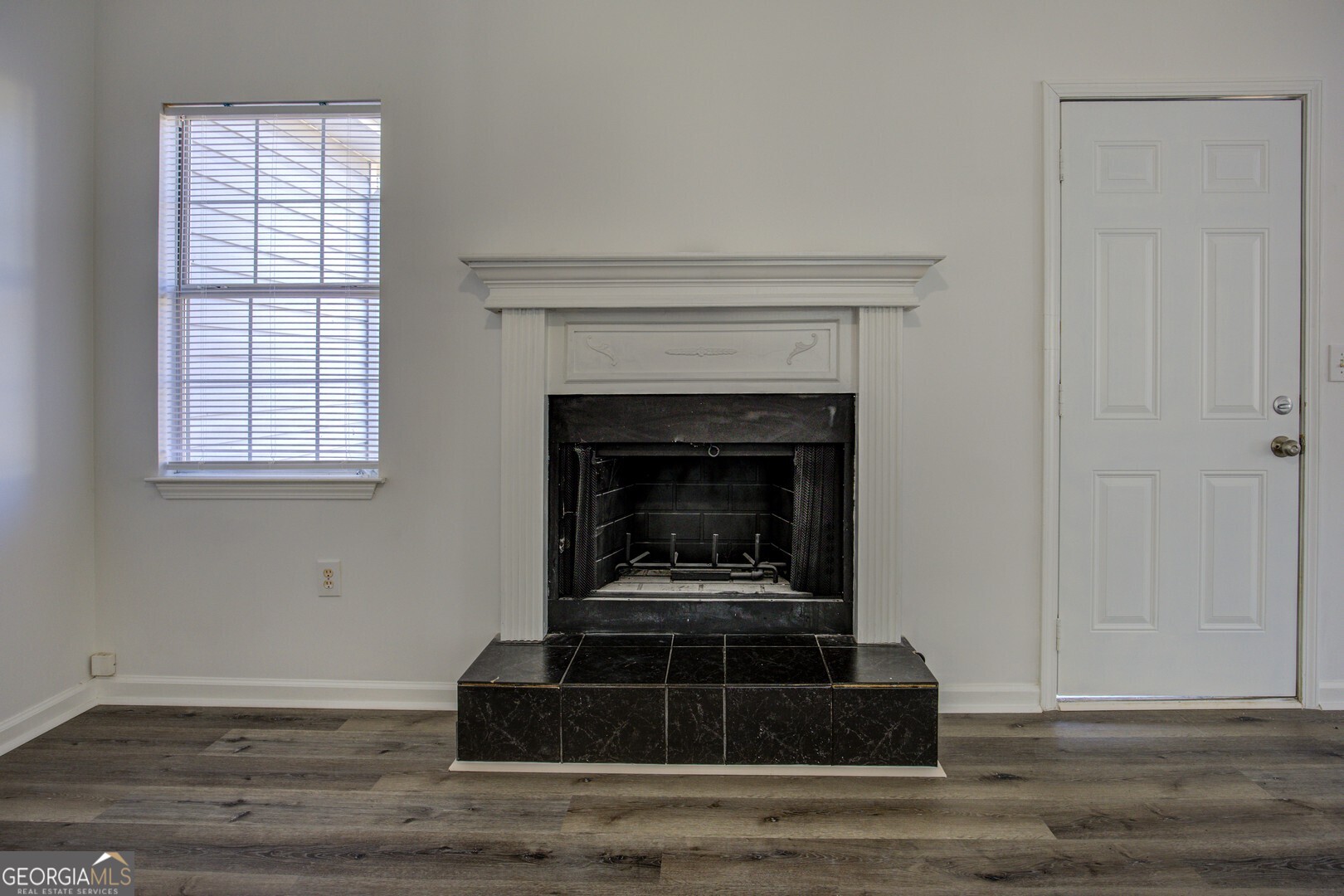 40 Brandon Drive Covington, GA 30016 - Photo 10 of 40 a living room with furniture and a fireplace