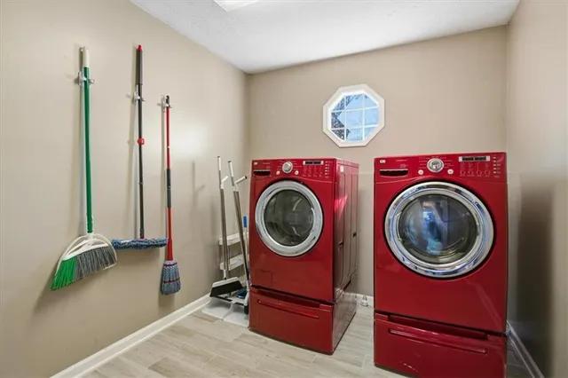 a view of a hallway with washer and dryer