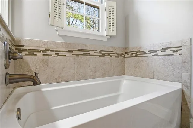 a close view of a bathtub in a bathroom