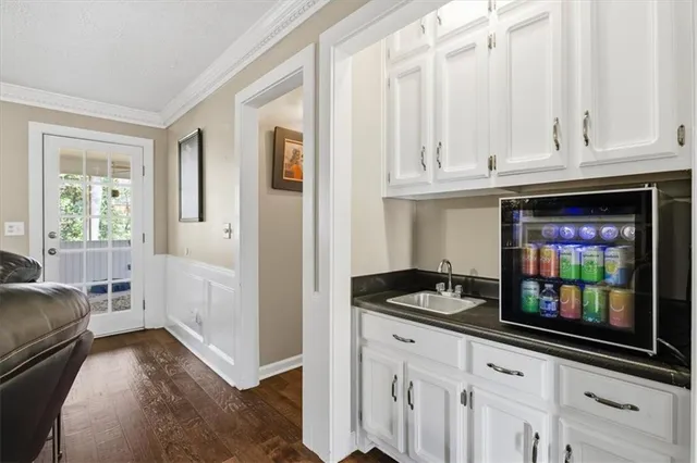 a kitchen with granite countertop a stove and a refrigerator