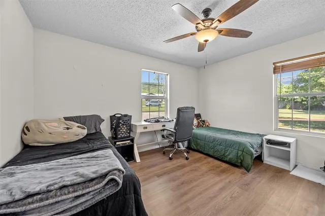 a bedroom with furniture and a window