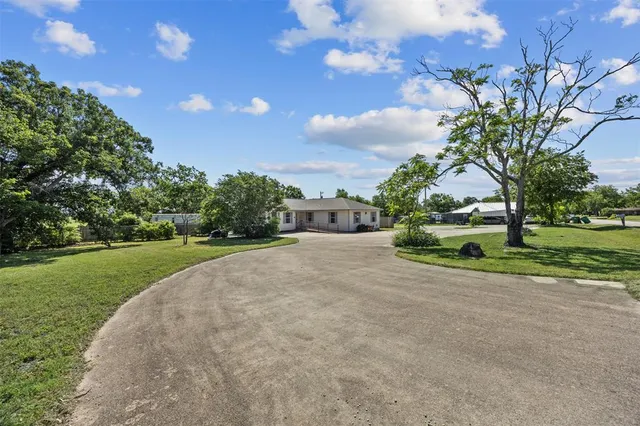 a view of a house with a big yard