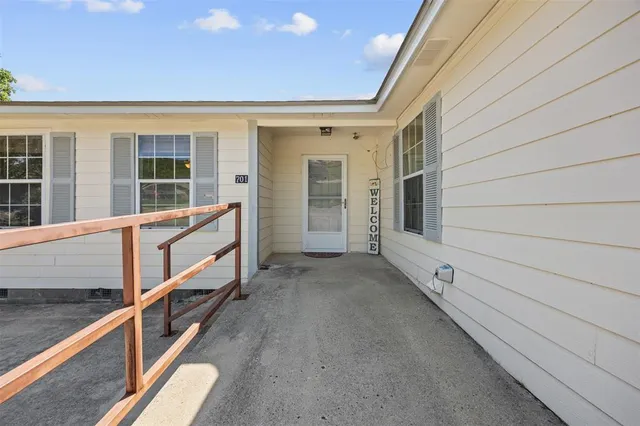 a view of balcony with furniture