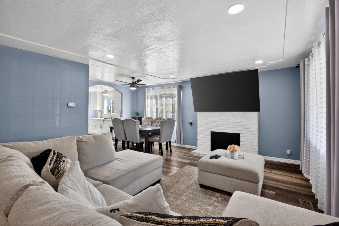 24 Amesti Road Watsonville, CA 95076 - Photo 5 of 27 a living room with furniture a fireplace and a flat screen tv