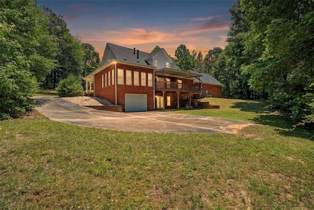 1136 Cole Lake Road Dallas, GA 30157 - Photo 61 of 72 a view of a house with backyard and trees