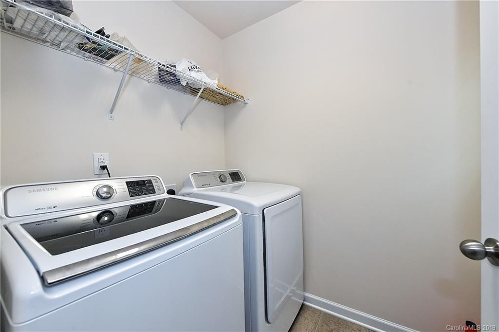 1580 Spring Blossom Trail Fort Mill, SC 29708 - Photo 19 of 22 a utility room with dryer and washer
