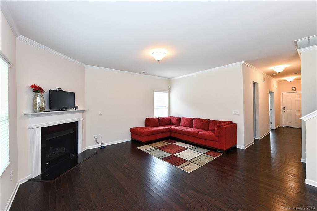 1580 Spring Blossom Trail Fort Mill, SC 29708 - Photo 6 of 22 a living room with furniture fireplace and flat screen tv