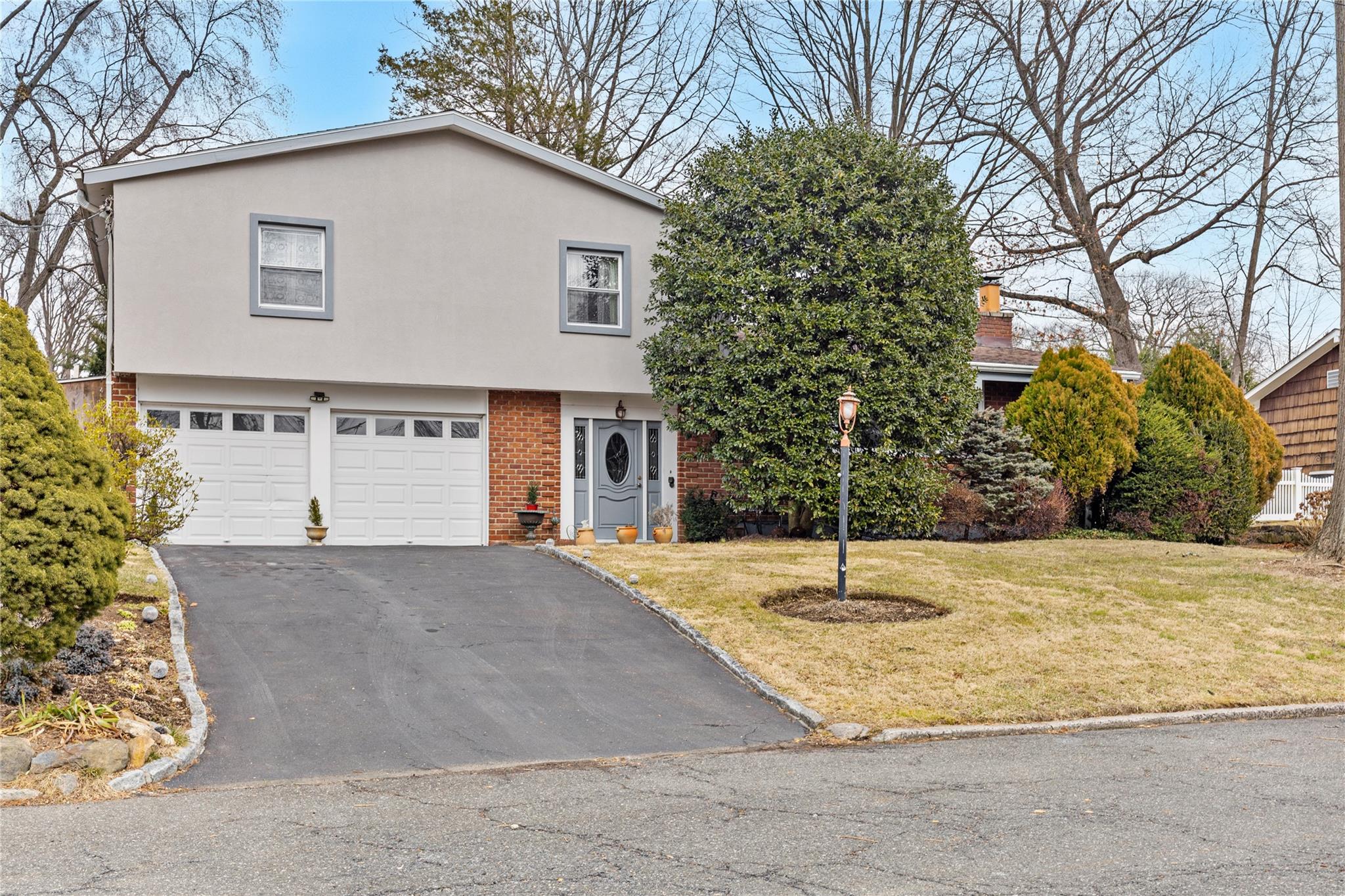 20 Hunt Path New Rochelle, NY 10804 - Photo 1 of 1 View of front of home with a garage and a front lawn